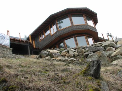 Exterior cliff perspective of West Coast Home on Pender Island built by Dave Dandeneau of Gulf Islands Artisan Homes